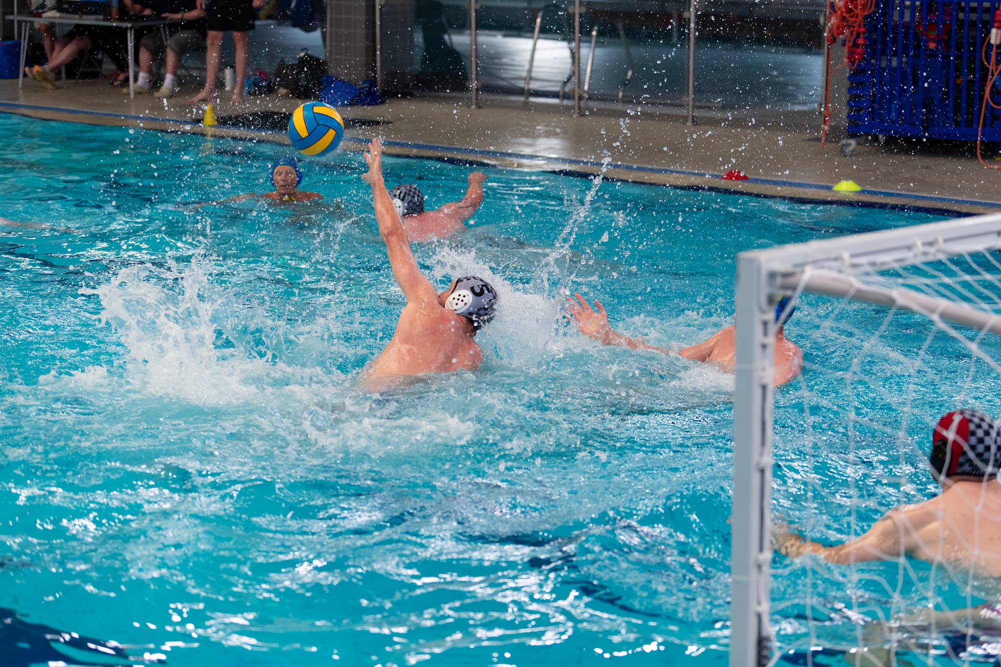 Masters water polo tournament action photo
